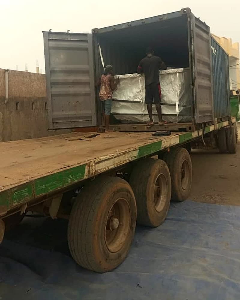Container on a trailer being loaded for export