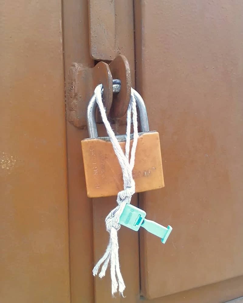 Padlocked and sealed warehouse door