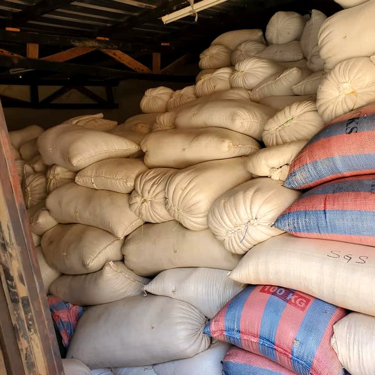 Bagged soybeans stacked in a warehouse during origination work