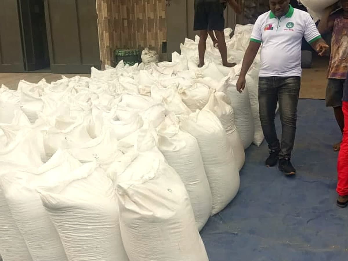 Bagged commodity being aggregated outside a warehouse before loading